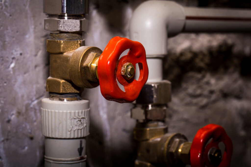 Brass valve with red handle control