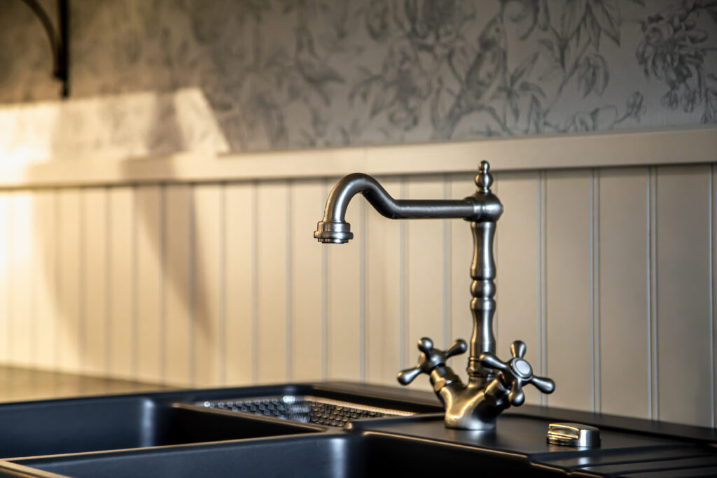 Vintage kitchen faucet and sink setup